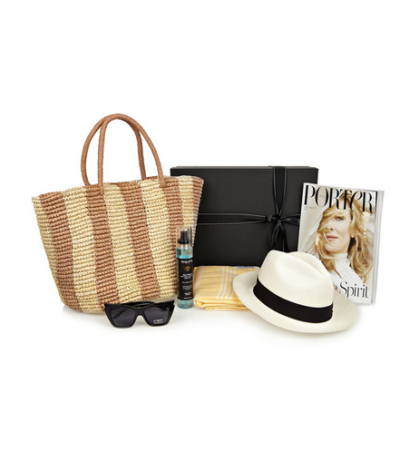 The Vacation Box: -PORTER Magazine Issue 5 -Chapéu Panama Sensi Studio -Oculos de Sol Le Spec's 'Rapture' -Philip B's 'Maui Wowie Beach Mist' para o cabelo -Toalha de praia  -Hammamas feita à mão  -Bolsa de palha Sensi Studio